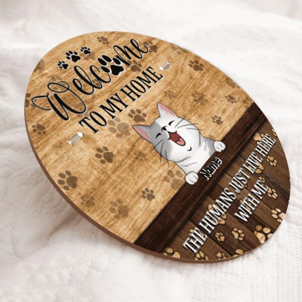 Welcome To Our Home, The Humans Just Live Here With Us, Cat Pawprints Background, Personalized Cat Lovers Door Sign